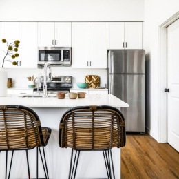a kitchen with a table and chairs