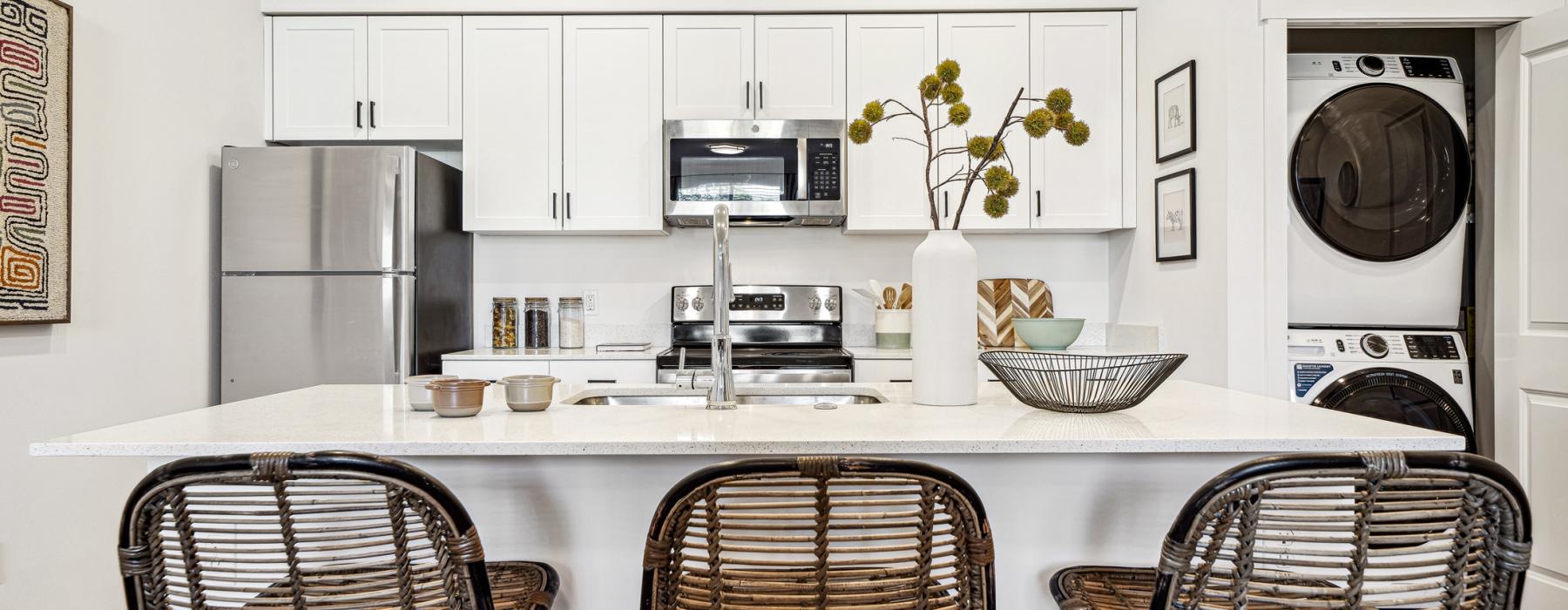 a kitchen with a table and chairs