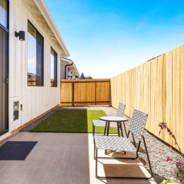 a patio with a table and chairs