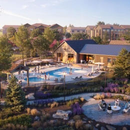 a swimming pool with a building in the background